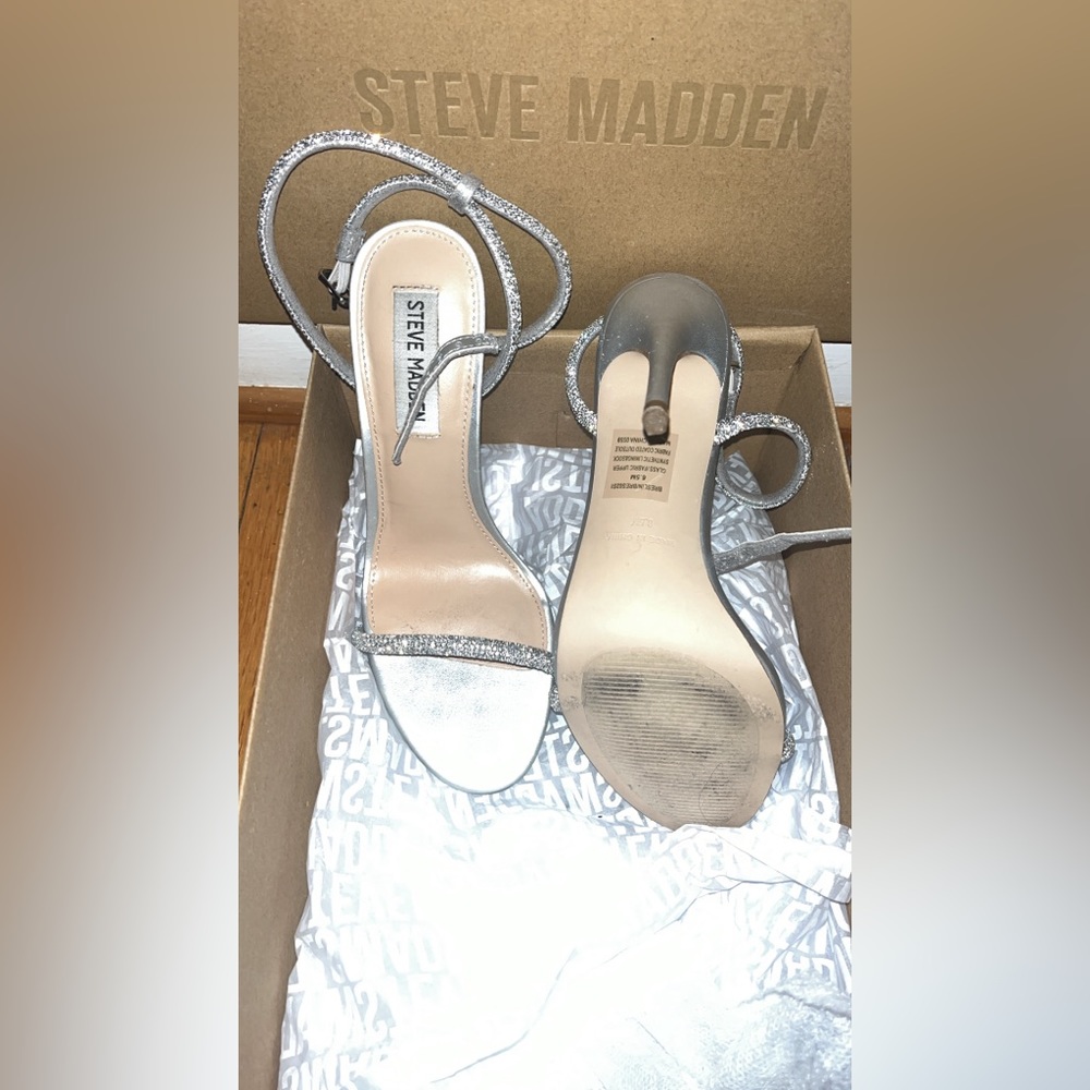 Worn once to a gala! Beautiful Steve Madden Crystal silver with crystal detail.